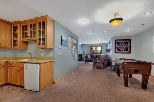 Enjoy ample space for billiards and a wet bar for game night gatherings