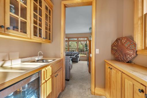 The butler's pantry offers flexible storage space, wet bar & under-counter beverage cooler.