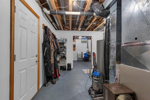 Plenty of storage space in unfinished area of basement, convenient walk out to garage!