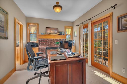 A walkout Den features in own fireplace and gorgeous views ~ step outside to enjoy the fresh air and sunshine