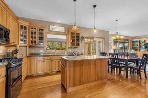 Stunning maple flooring, cabinets & millwork throughout