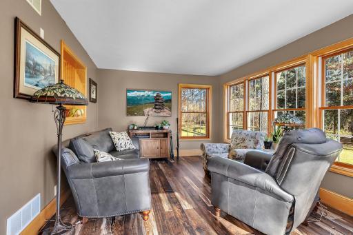 The 4-season sunroom offers an ideal respite to enjoy the sights of your secluded back yard