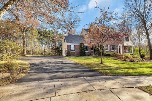 Gorgeous in any season, this corner lot is stunning