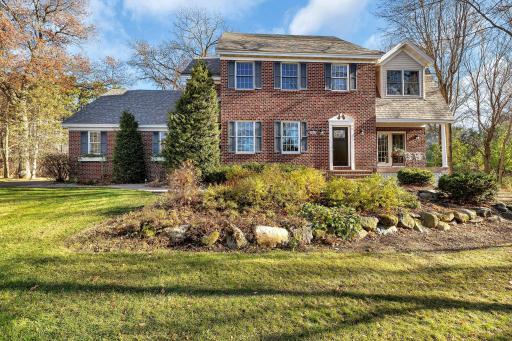 Beautifully landscaped providing gorgeous curb appeal throughout the seasons