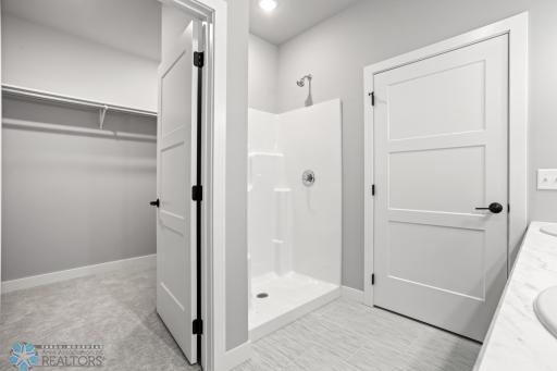 Primary Shower & Walk In Closet