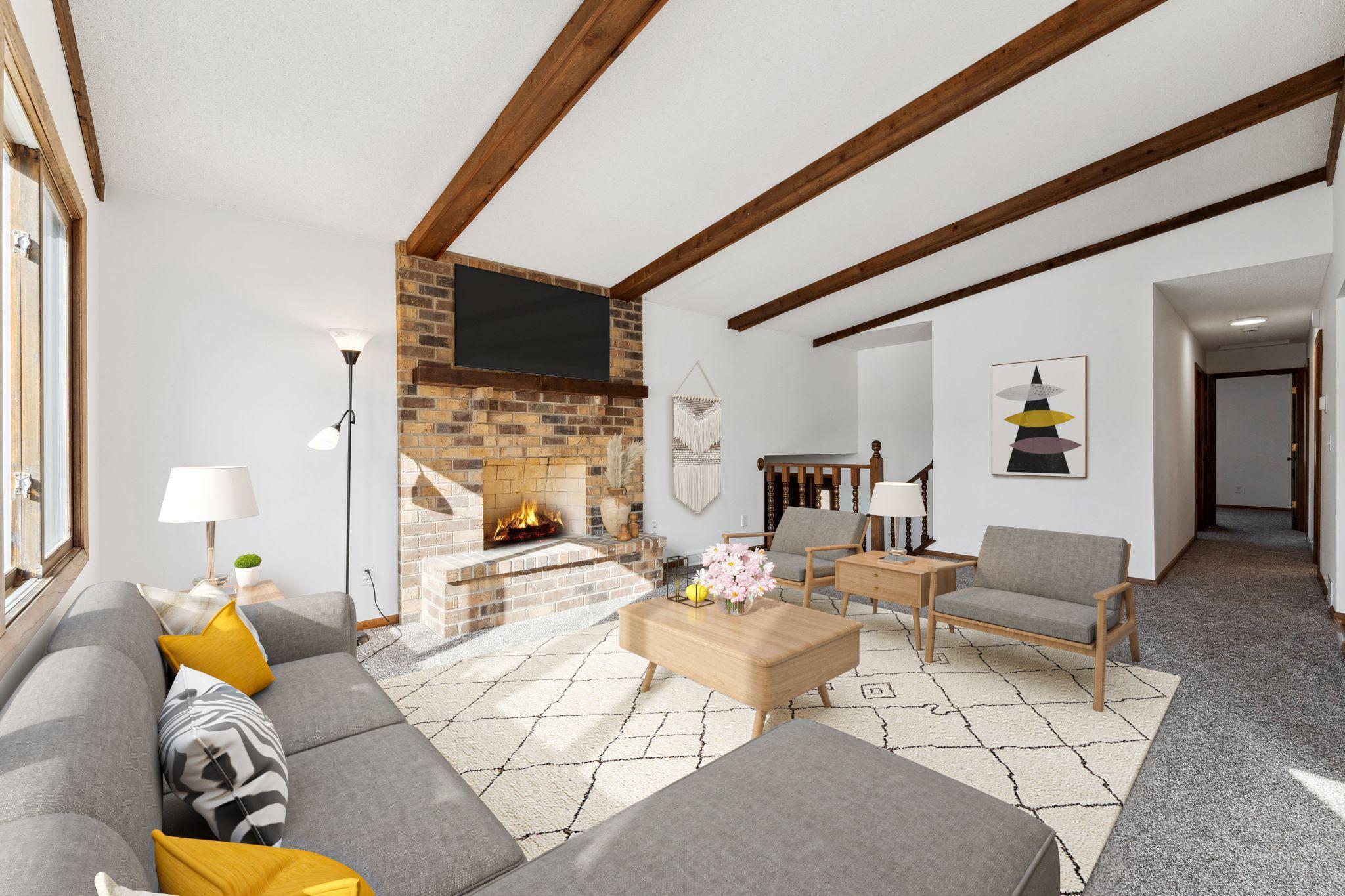 Virtually staged with area rug. Fireplace not in use. New carpet and paint.