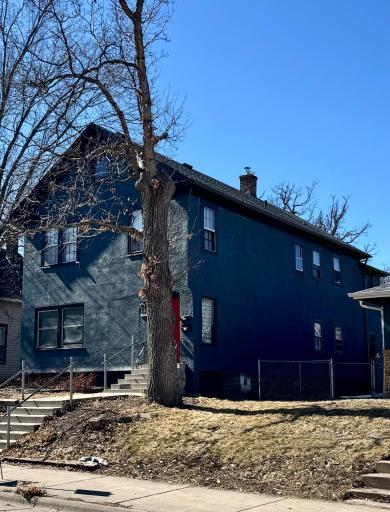 3019 Emerson Ave N features new roof and exterior paint.