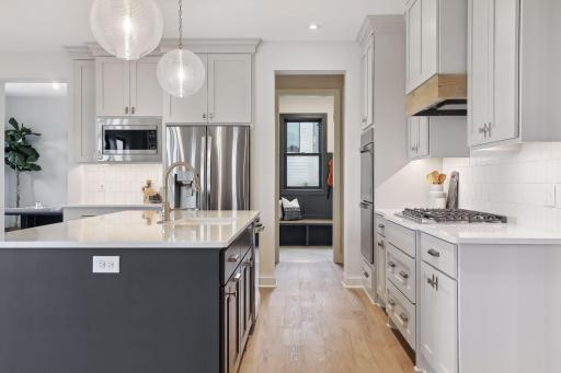 Kitchen into mudroom *image of like home, finishes may vary