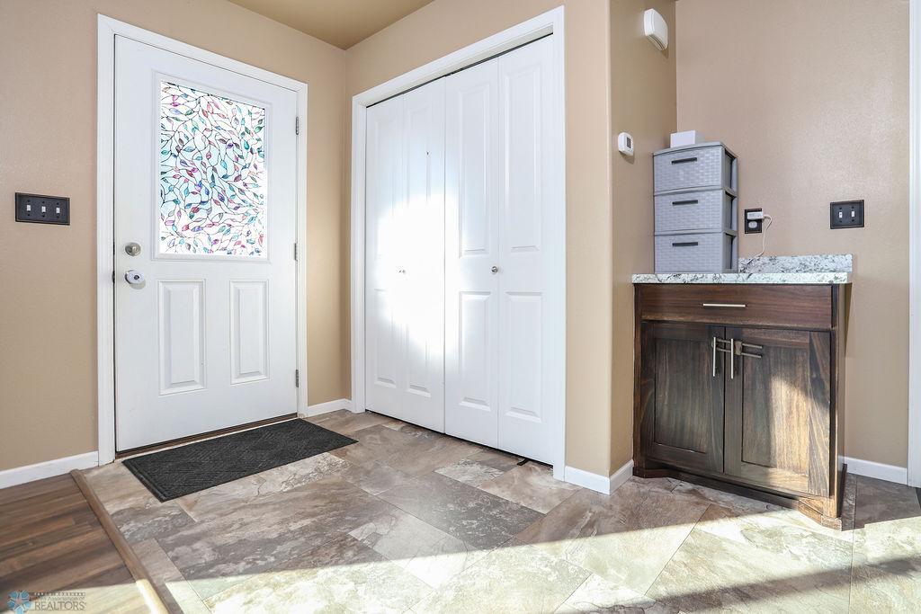 Entry closet and mudroom storage, convenient located between front and garage entries