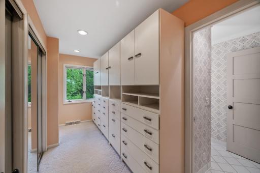 Closets within a closet: the walk-in closet has mirrored-door closets on the left. The closet next to the window is cedar-lined.