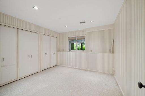 The second lower level bedroom has four storage closets.