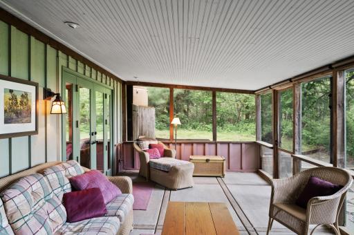 You will enjoy many a summer evening on this comfortable screen porch.