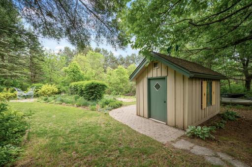 The charming garden shed and beautifully landscaped back gardens.