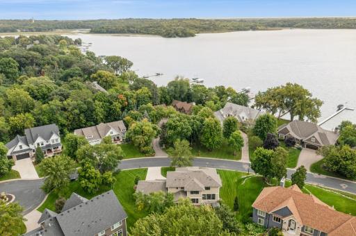 A beautiful beach access awaits you. Enjoy Lake Minnewashta with a day dock to tie up your boat and paddle board/kayak storage slot.