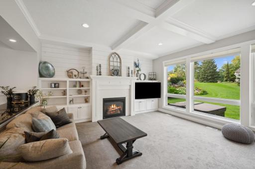 Natural light pours in through the expansive Andersen windows, illuminating the home's elegance.