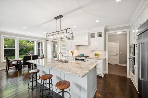 The gourmet chef's kitchen is a sight to behold, featuring stunning custom cabinetry.