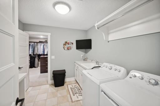A luxurious primary suite wouldn't be complete without a laundry room attached to your closet!