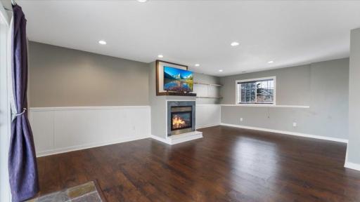 Basement Family Room features engineered hardwood flooring.