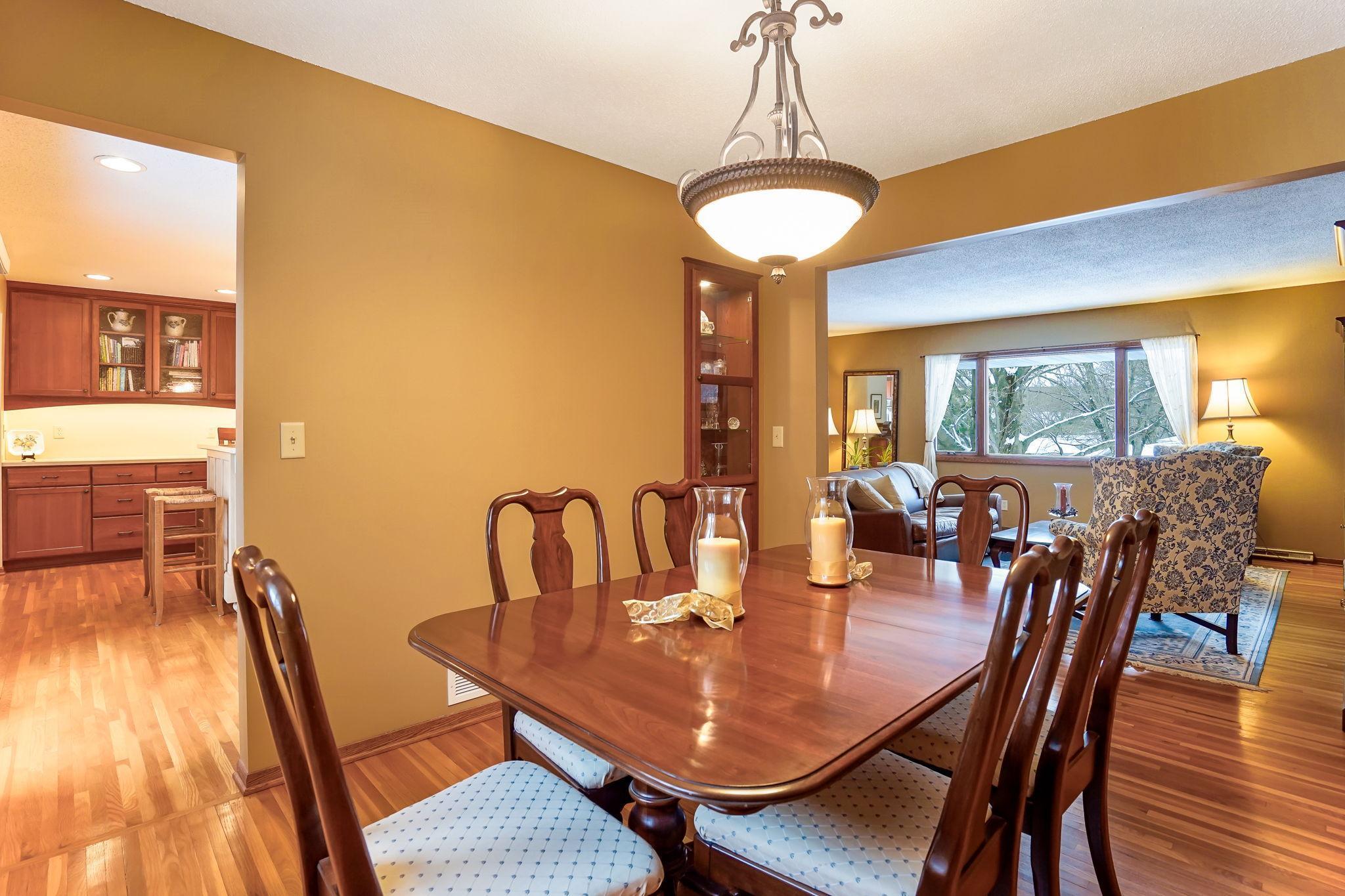 Dining room has hardwood floors, updated lighting