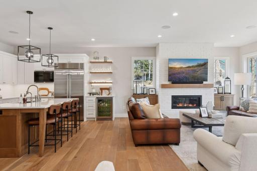 This open floor plan is perfect for entertaining. All of your friends and family will be able to gather around the large center island featuring quartz countertops, subway tile backsplash and top of the line stainless steel appliances.