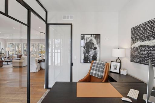 As you step into the home, this office is located on your right with an all glass wall.