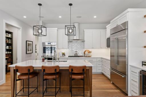 Another view of kitchen showcases pendant lighting in black and smoke!