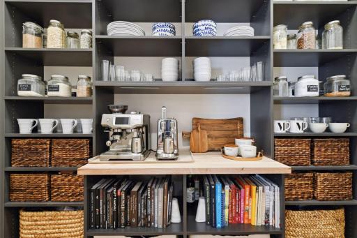 Fun pantry/coffee bar area with ample storage to keep you all organized!