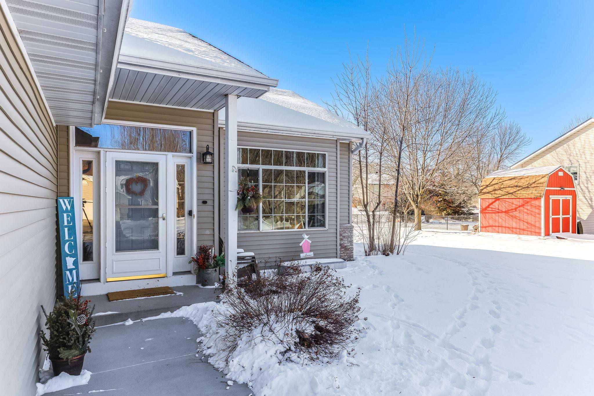 Inviting front entry, new concrete sidewalk and in front of garage