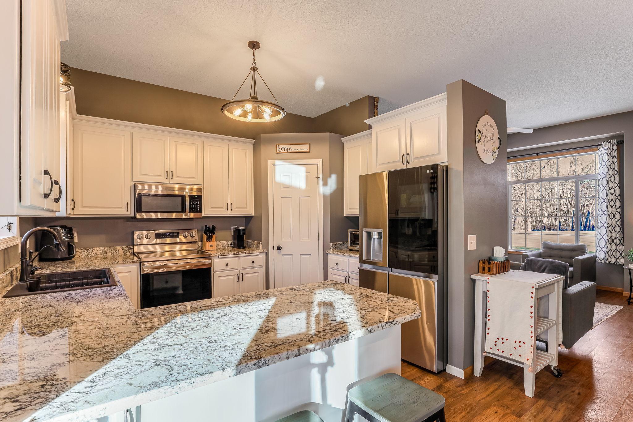 New granite countertops, newer upgraded stainless-steel appliances, walk-in pantry