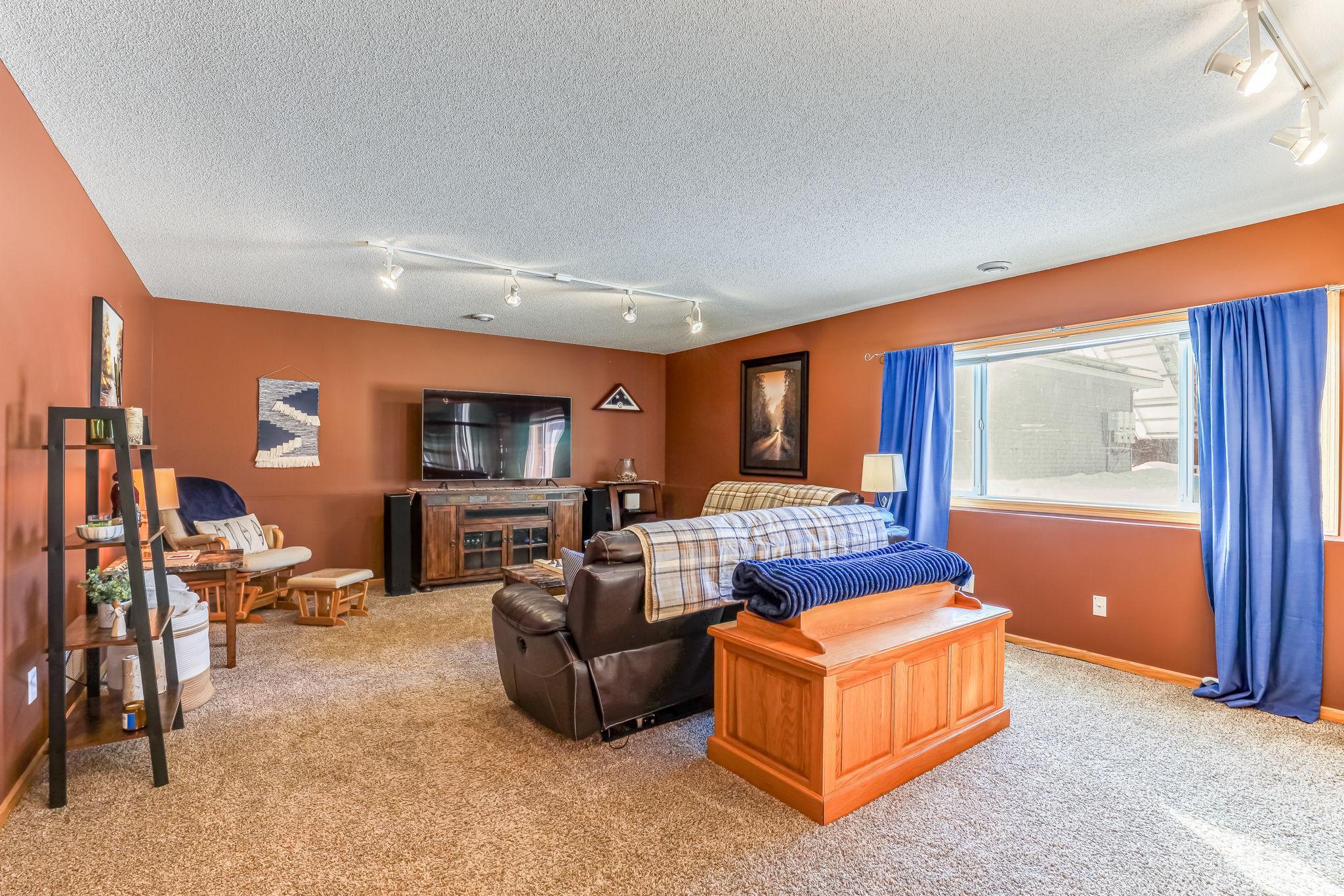 Spacious family room, with large window looking out to backyard