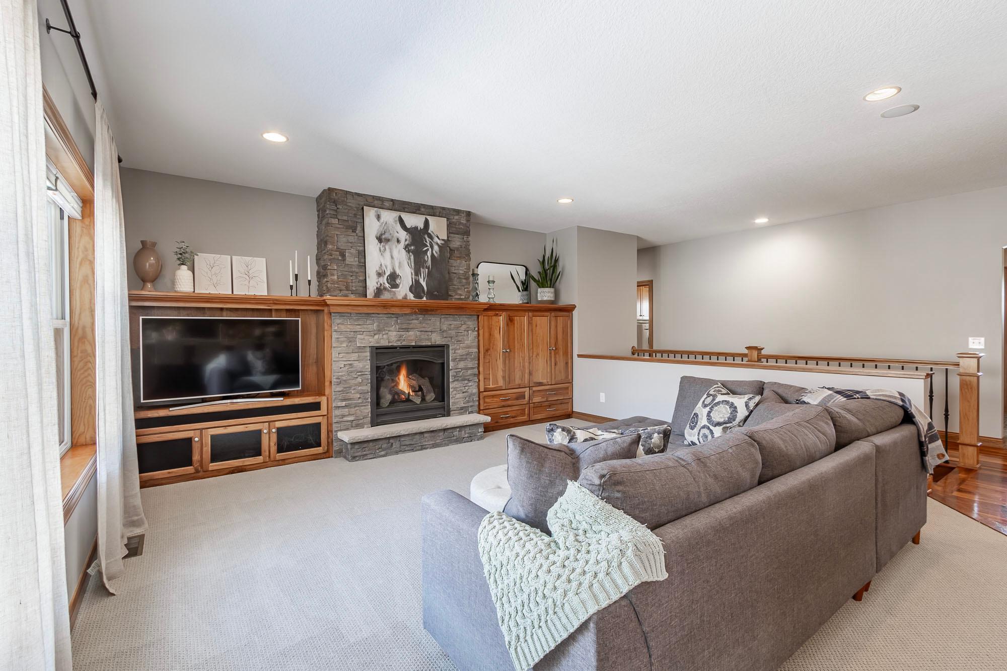 Open living room with cozy gas fireplace