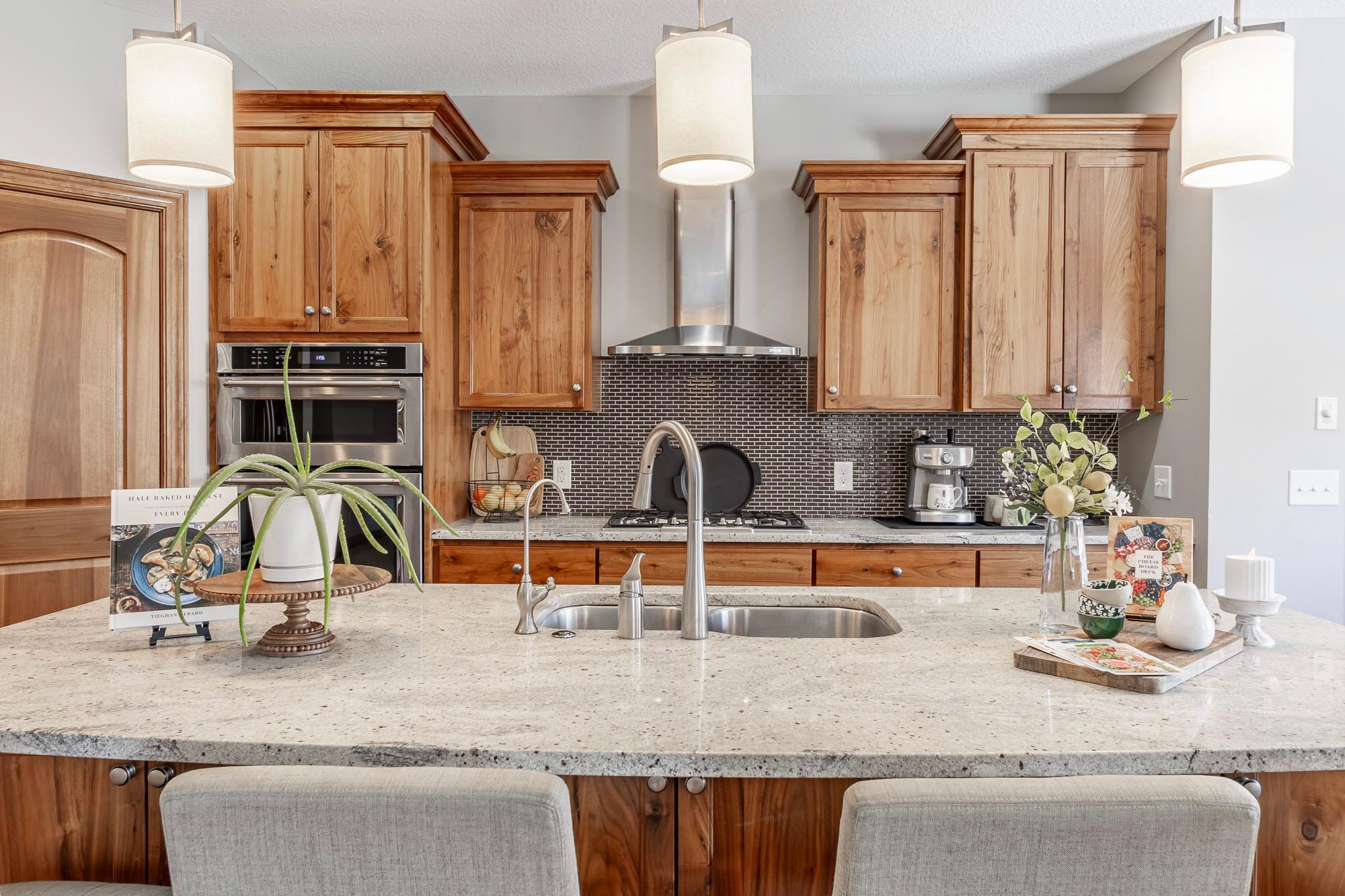 Granite countertops and stylish tile backsplash!