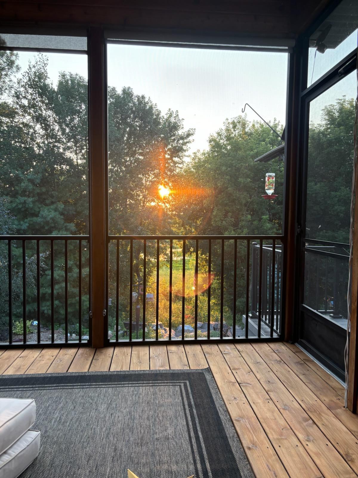 Watch the sunsets from this gorgeous screen porch!