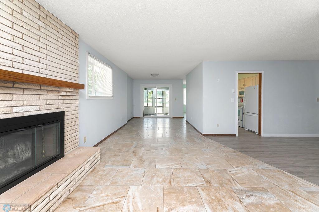 Living room view to sunroom & kitchen