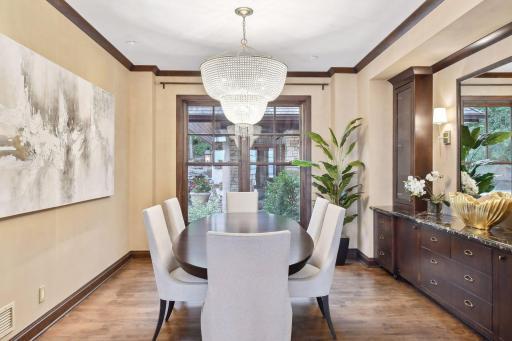 The dining room, office, and luxurious primary bedroom complete the main level.