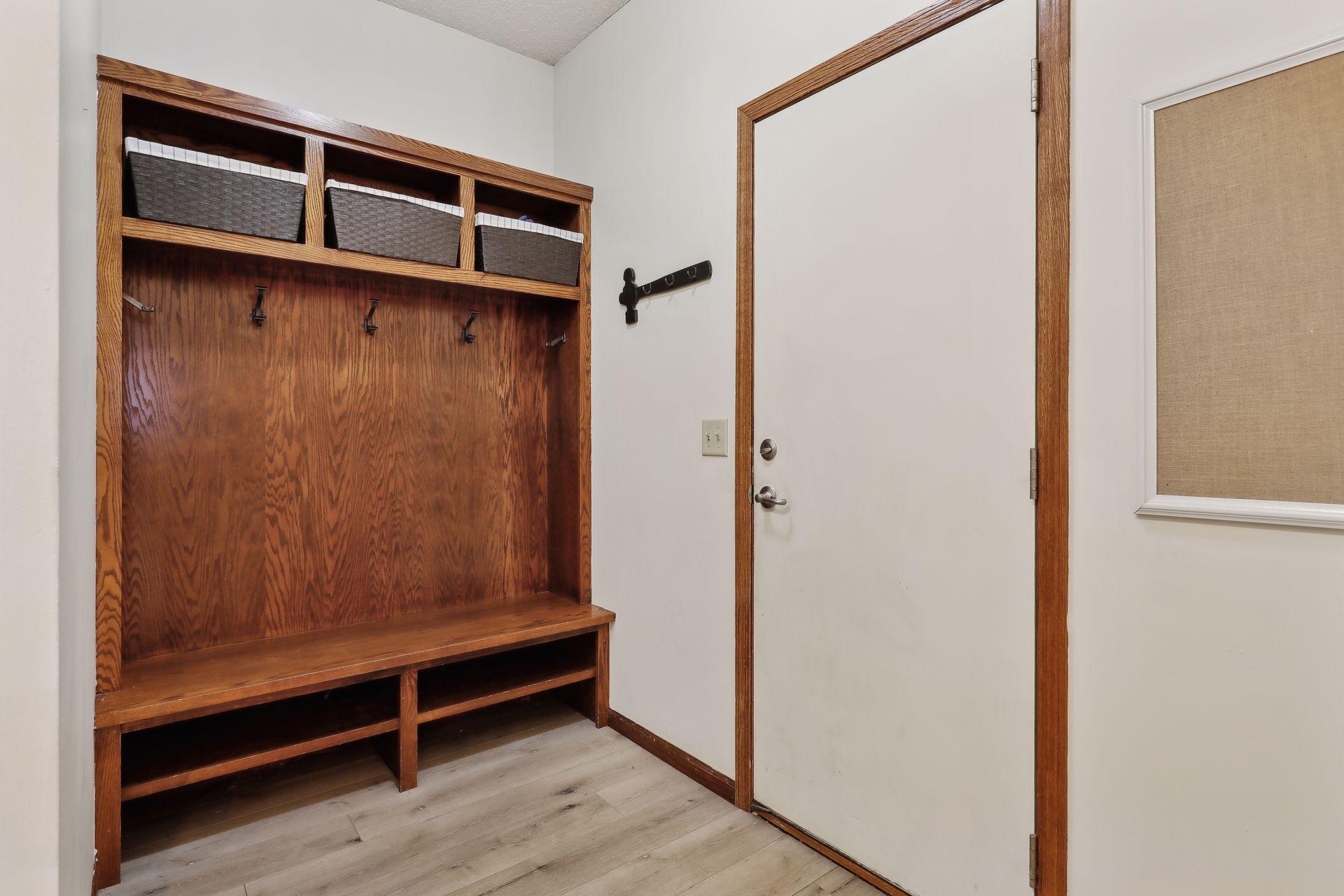 Back hallway for coats and walk-in closet