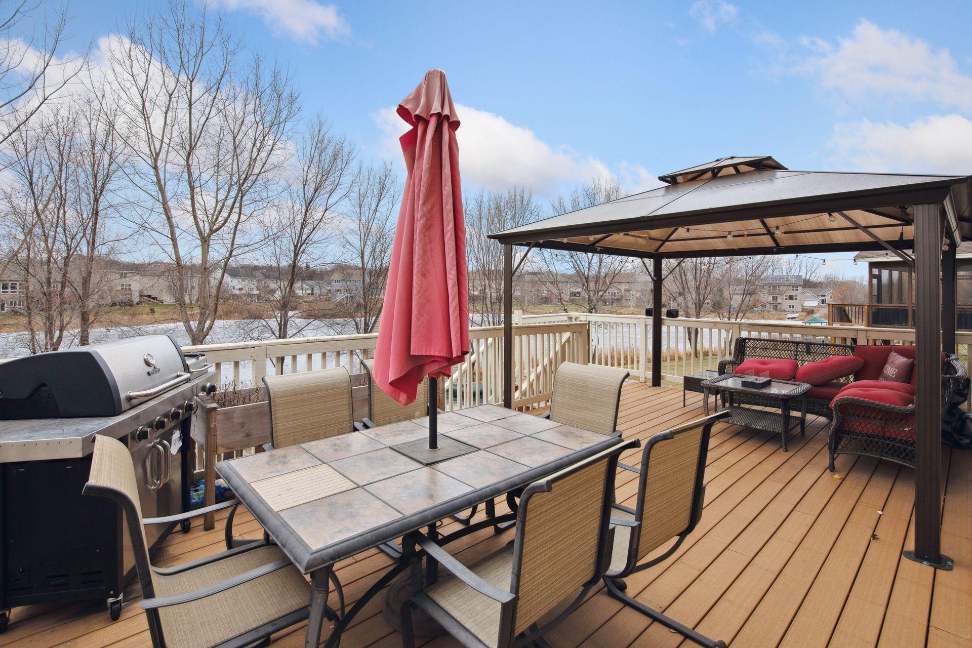 Great deck overlooking backyard and pond