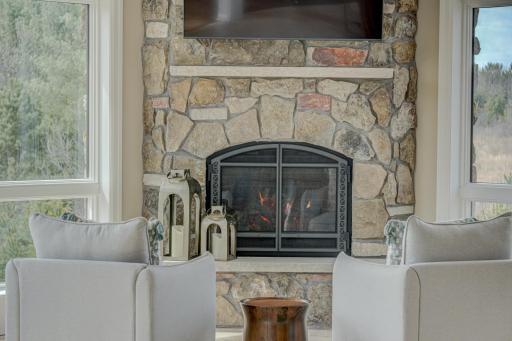 Stone fireplace in sunroom.