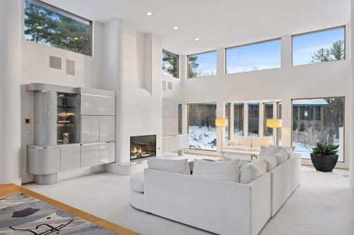 Soft contemporary in design with an abundance of oversized windows to fill spaces with natural light