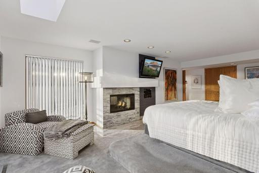 Cozy gas fireplace in the primary bedroom