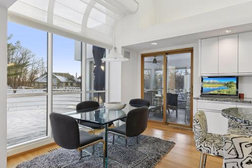 Informal dining area within the kitchen, with access to the sun room