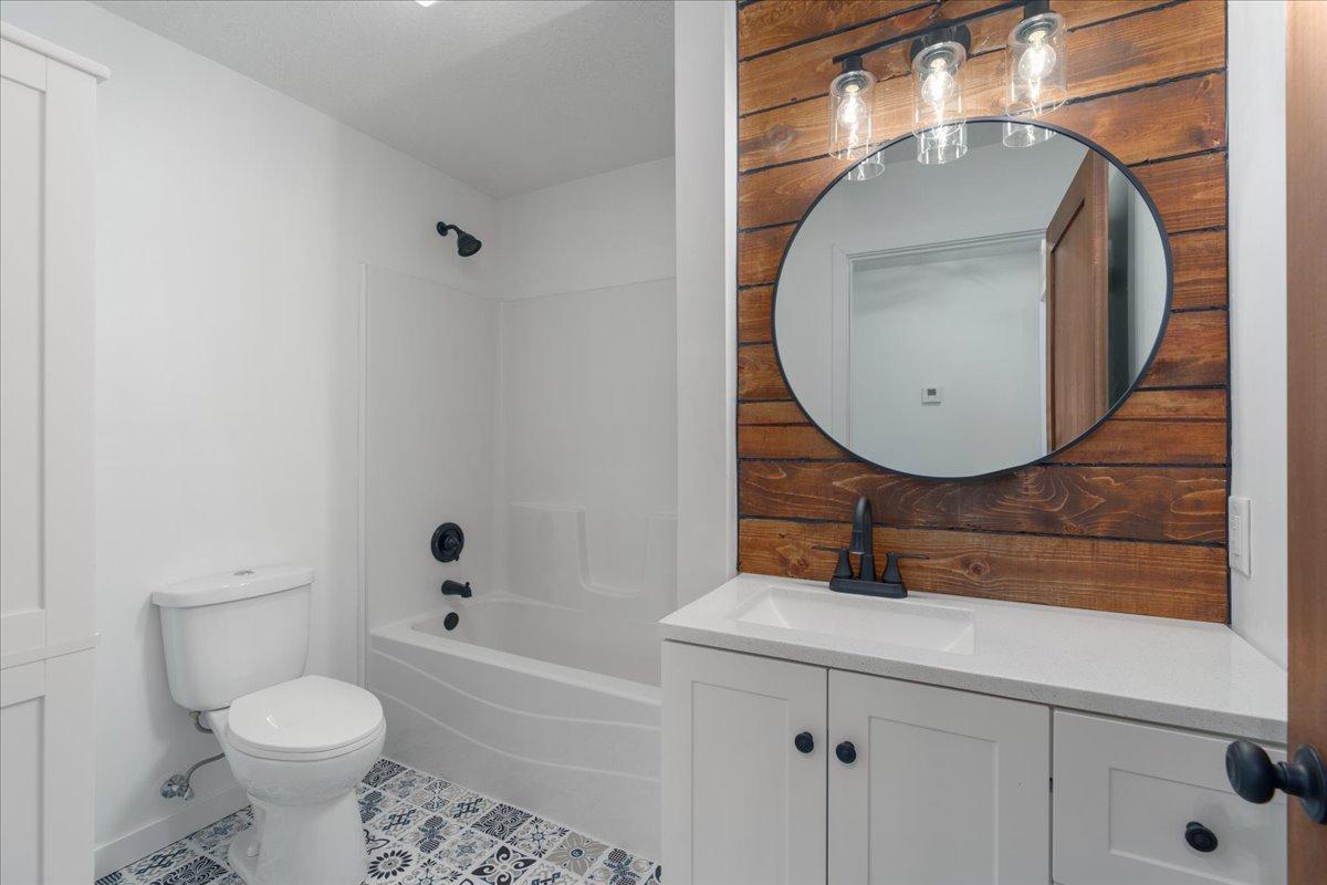 Main floor full bathroom with stunning natural wood