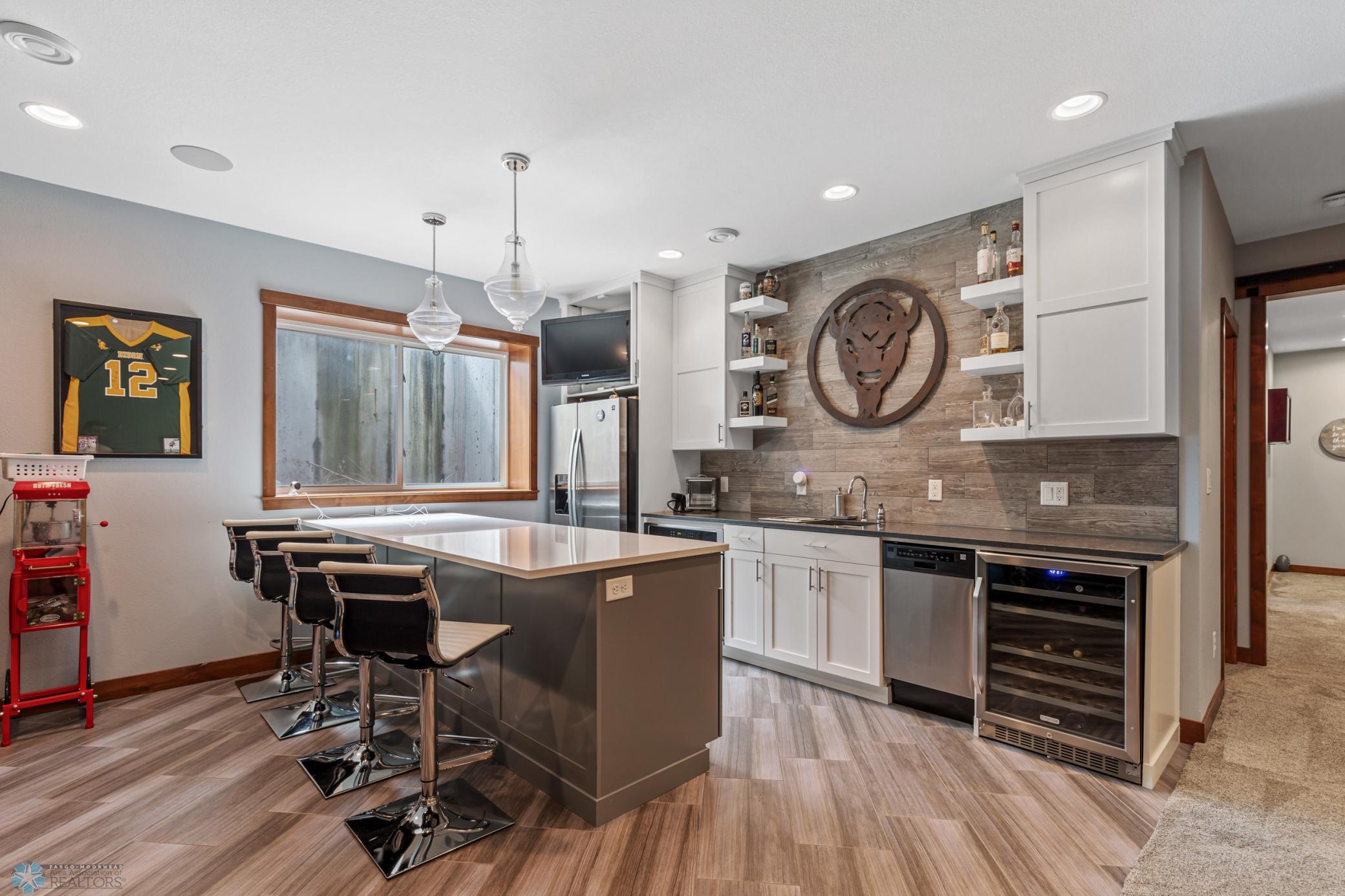 Wet Bar- Full fridge, oven, dishwasher & beverage fridge