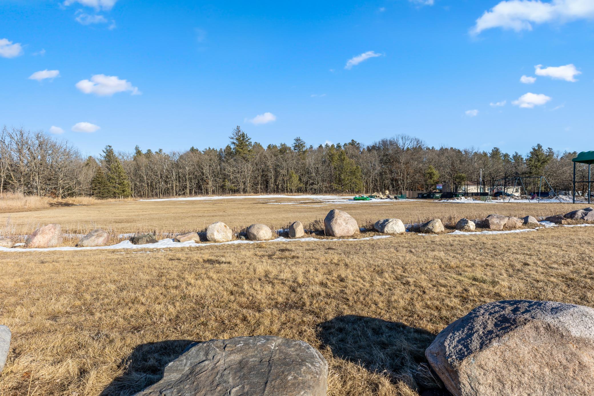 Shared Playground Area and Field. Brand new playground being installed.