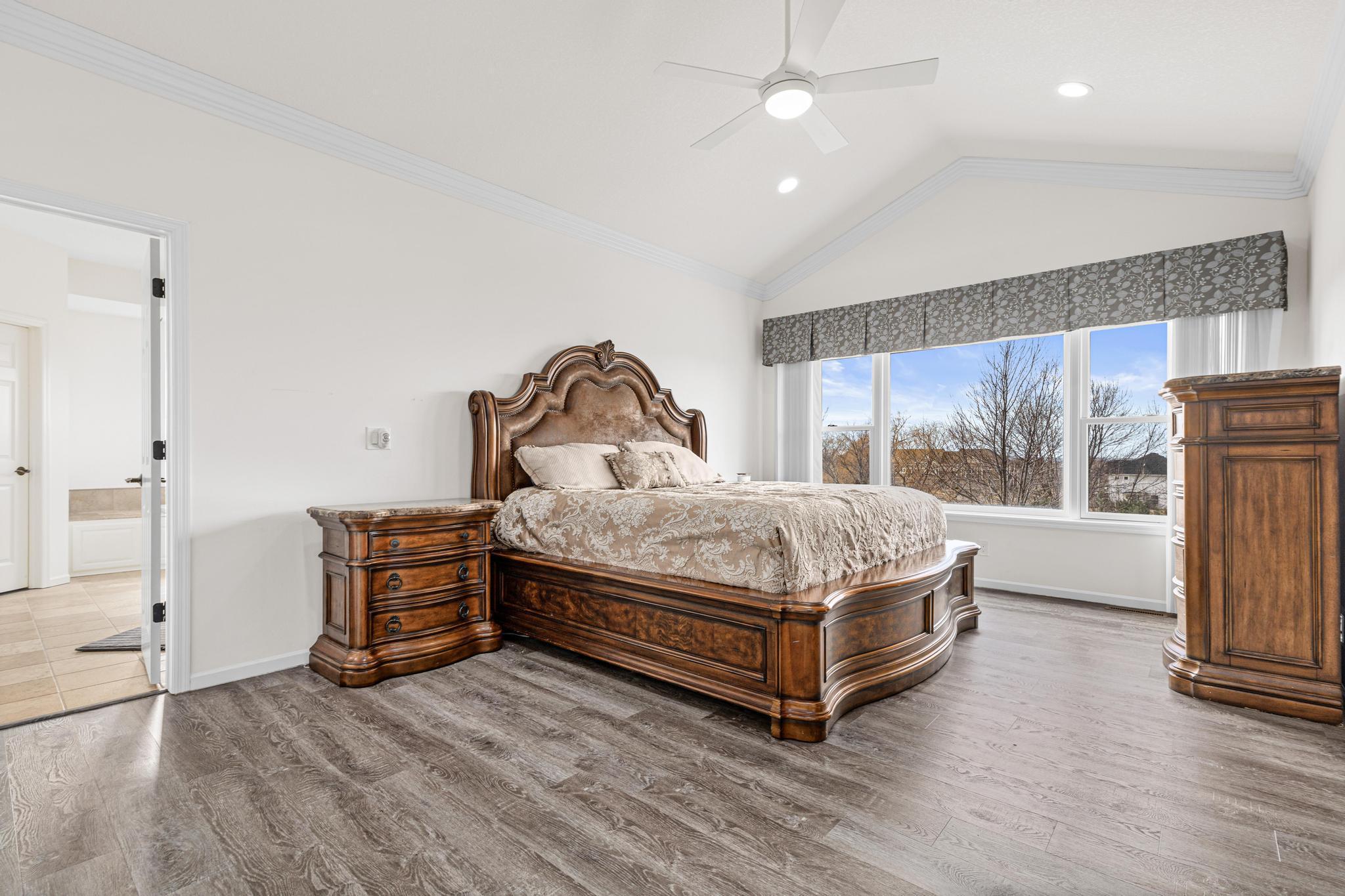 Owner's room w/ 2 closets, private bath, and WIC with programable blinds