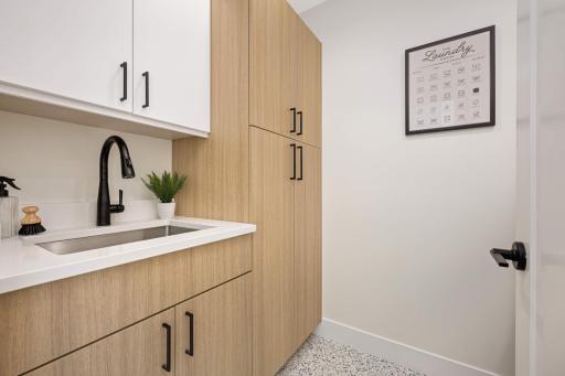 Laundry- washer and dryer on backside of door.