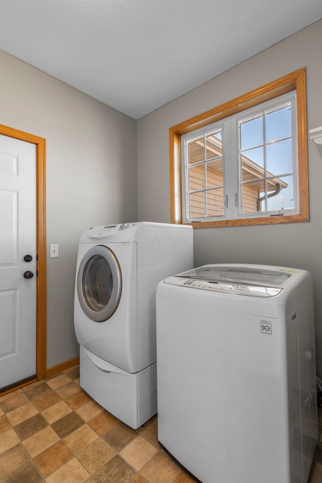 The laundry room is conveniently located on the main level, right off the entrance to the attached 3-car garage.