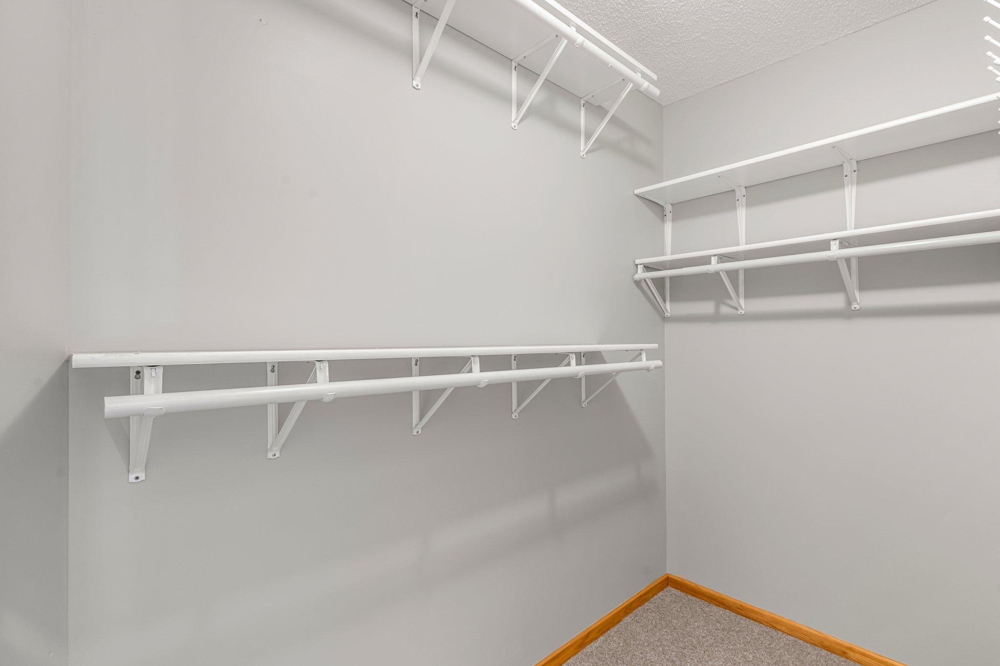 The spacious 8x4 walk-in closet offers plenty of room for all your wardrobe needs.