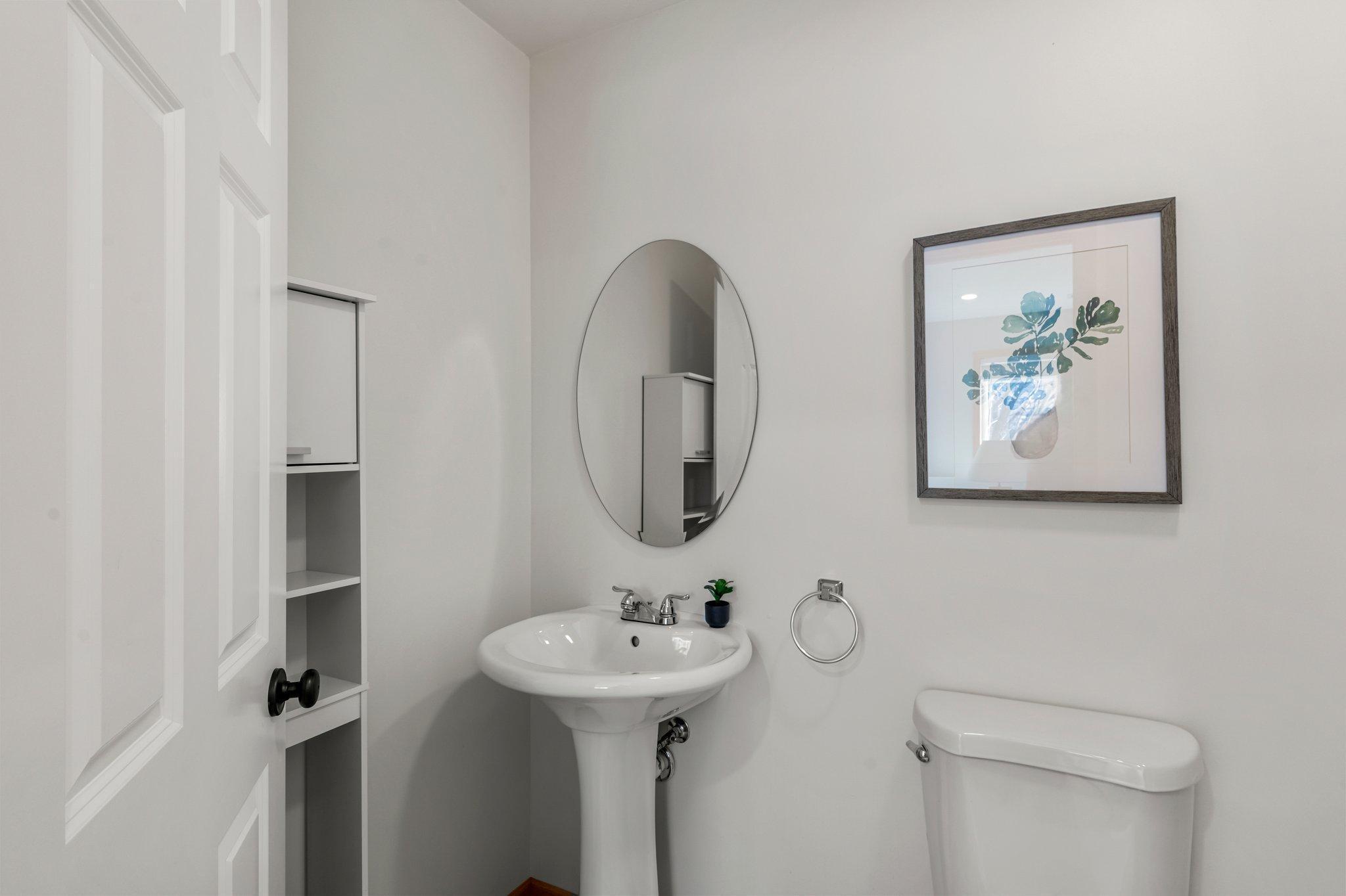 View of the private half bathroom located in the lower-level bedroom.