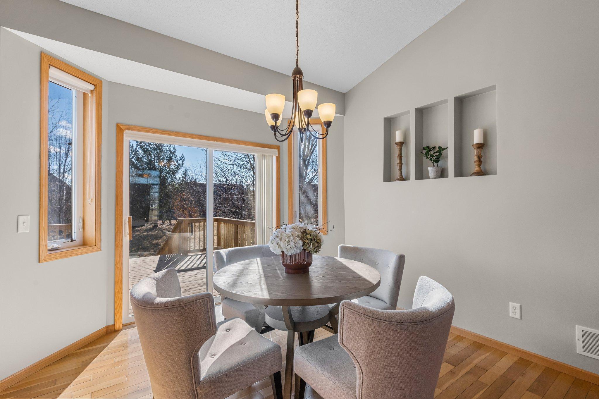 The dining room gives access to a 16x12 deck, ideal for seamless indoor/outdoor entertaining.